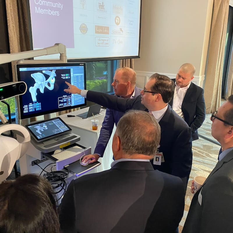 Dr. Avino demonstrating Mako robotic 3D surgical planning software at community event
