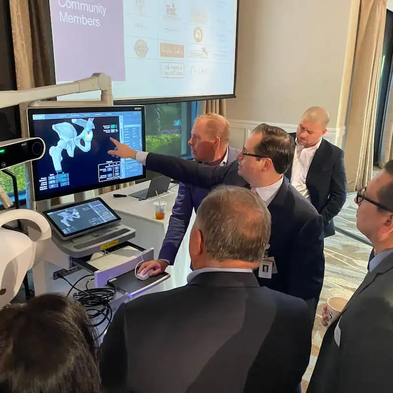 Dr. Avino demonstrating Mako robotic 3D surgical planning software at community event