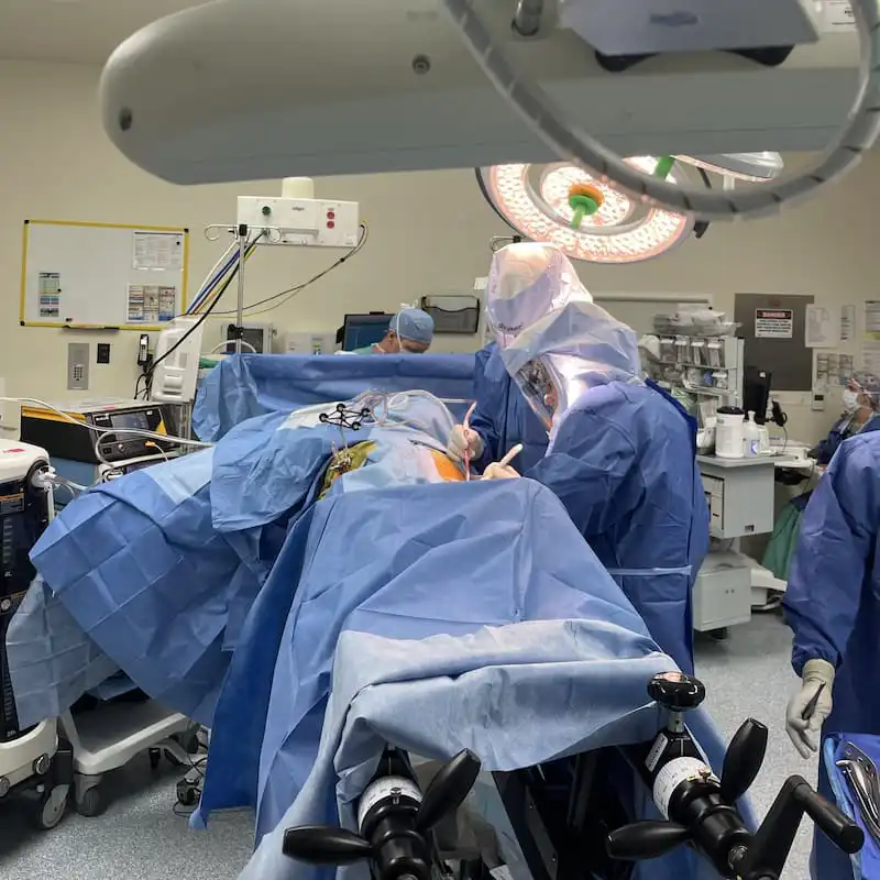 Dr. Avino performing Mako robotic-assisted joint replacement surgery in operating room